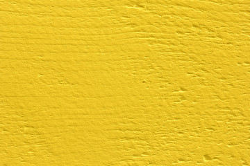 Fototapeta premium Macro photo of old yellow painted wood plank. Timber background. 