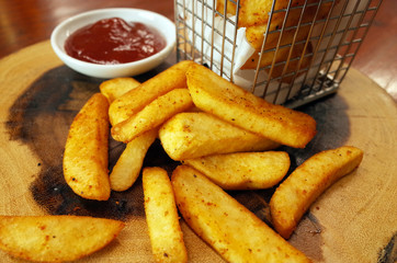 French fries on wooden table