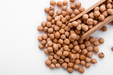 uncooked chickpeas on a white acrylic background