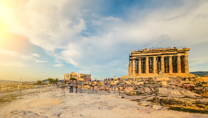 Panoramic view of Acropolis hill with ancient Parthenon temple restoration on sunset, Athens, Greece