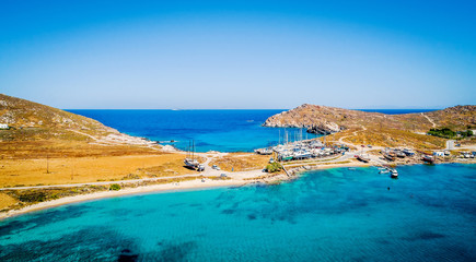 Aerial panoramic view of quay with sailing boats on trailers on the shore of Paros island, Greece. Boats launching process