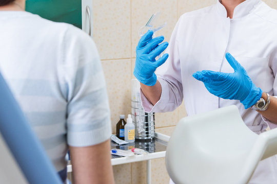 Woman health concept - doctor (gynecologist or psychiatrist) consulting woman patient in the clinic, closeup photo