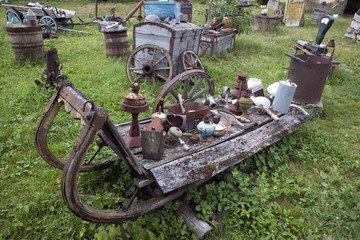 Open air museum of old unnecessary things, antique unwanted junk in old open sleigh