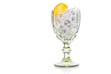 glass with cold water with ice and lemon isolated on a white background