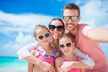Fototapeta premium Happy family with kids walk on the beach