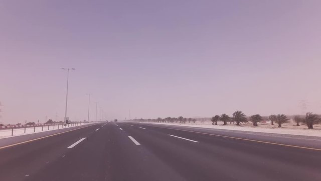 Sandstorm sweeps the sand on highway stock footage video