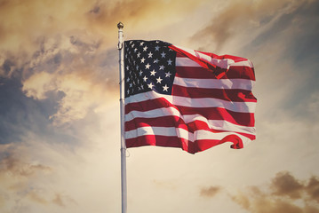 american flag waving in the sky, toned wth instagram filter - Powered by Adobe