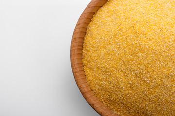 raw Italian corn porridge polenta on a white background
