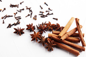 cinnamon, staranise and cloves. winter spices on white background