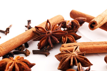 cinnamon, staranise and cloves. winter spices on white background