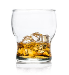 Isolated whiskey glass with the drink and cubes of ice