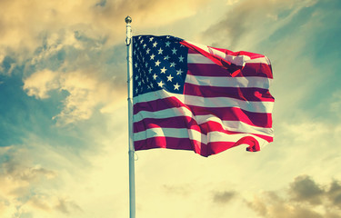 american flag waving in the sky, toned wth instagram filter
