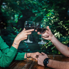 Couple Toasting With Red Wine On A Date