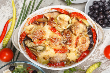 Traditional tasty rustic stew of chicken and vegetables  with Greek salad and black olives