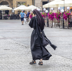 A nun talking on the phone