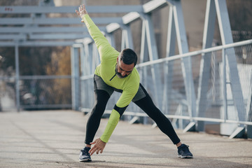 A Man Runner Doing Stretching Exercise