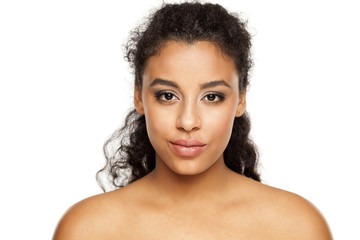portrait of a young dark-skinned woman on a white background