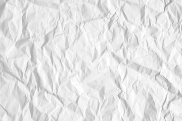 Texture of white crumpled white paper with kinks and dents. Flat lay, top view, copy space 