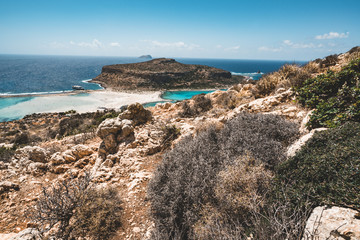 View of the beautiful beach in Balos Lagoon, and Gramvousa island on Crete, Greece. Sunny day, blue Sky with clouds.