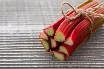 fresh rhubarb on a wooden rustic background