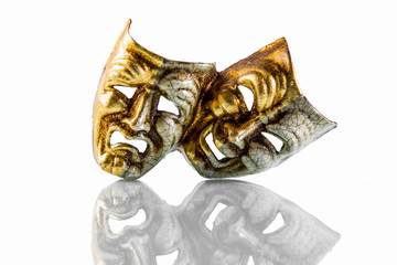 theatrical masks happy and sad photographed on white background