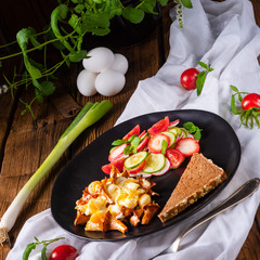 fresh chanterelles with scrambled eggs and a green salad
