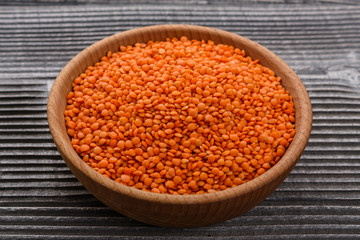 raw lentils on a wooden rustic background