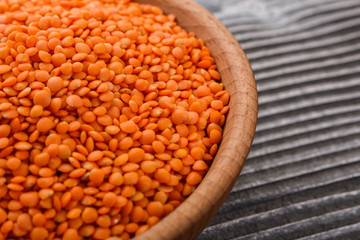 raw lentils on a wooden rustic background
