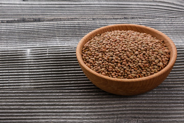 raw lentils on a wooden rustic background