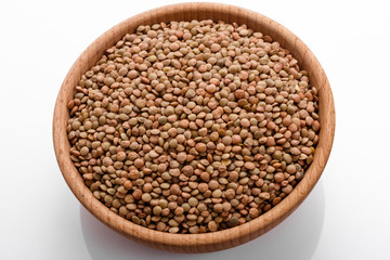 raw lentils on a white acrylic background