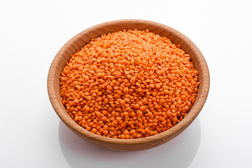 raw lentils on a white acrylic background