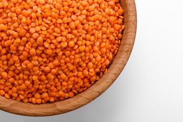 raw lentils on a white acrylic background