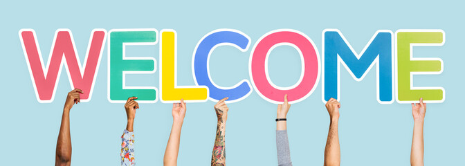 Hands holding the word welcome