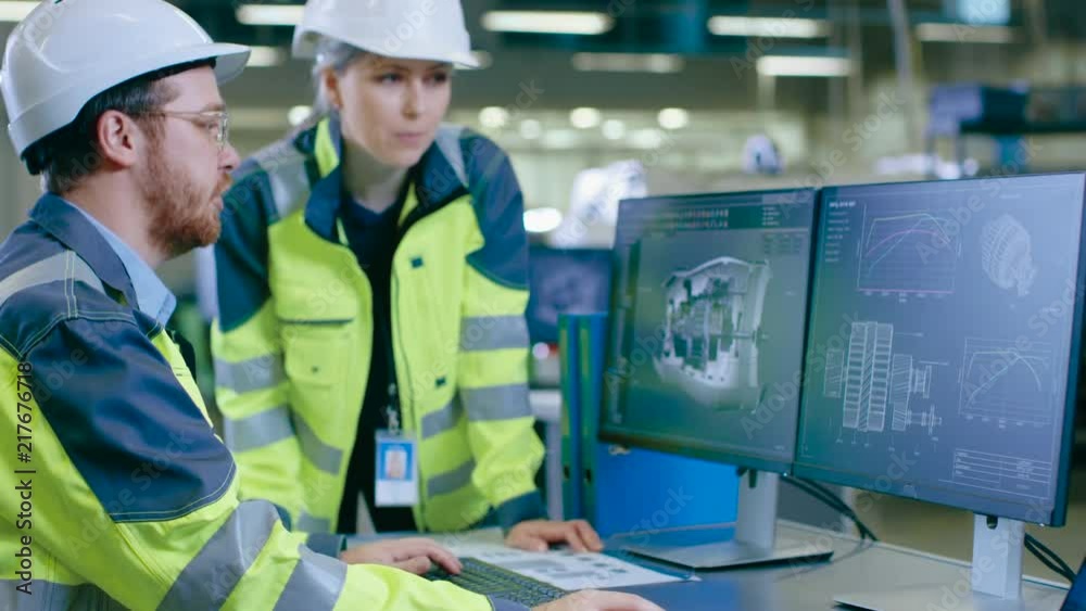 Poster inside factory male mechanical engineer works on personal computer while female chief engineer consu