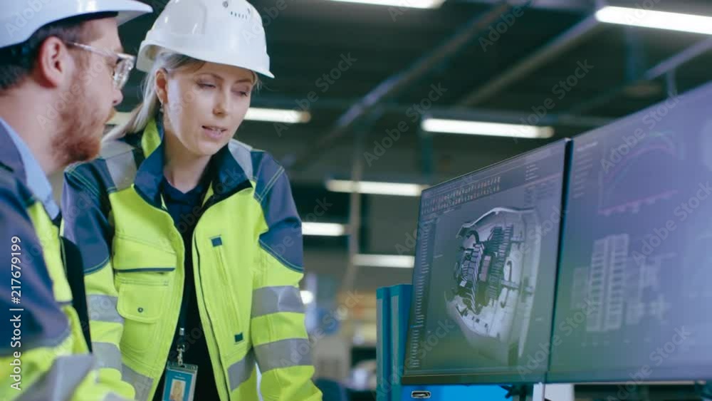 Poster inside factory male mechanical engineer and female chief engineer work together on the personal comp