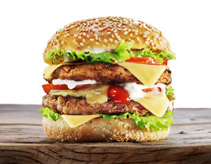 Hamburger on wooden table.