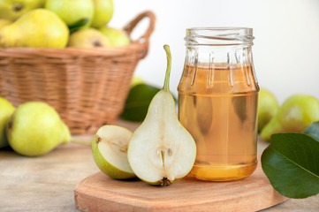 Pear juice with fresh fruit in the basket