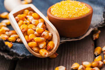 a bowl of corn is on a wooden table