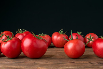 tomatoes on wooden background