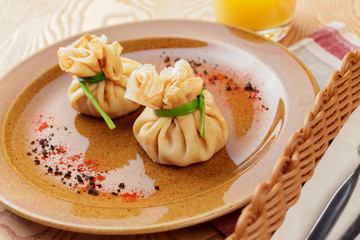Stuffed pancake bags tied with green close up