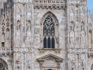 Fototapeta na wymiar Milan, Italy - June 2018 : Famous Milan Cathedral (Duomo di Milano), view of the architecture details