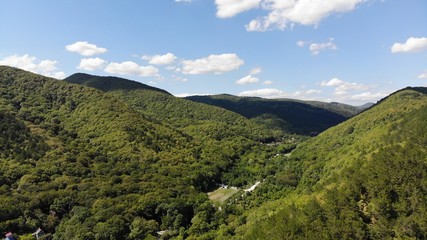 Fototapeta premium View of the mountains from the height on the summer day.