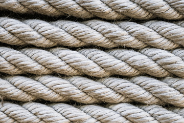Close up of rows of thick twisted rope cable in lines. For pattern, texture, background