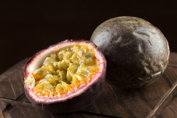 yellow passion fruit on wood background