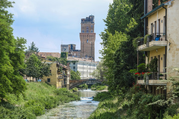 Fototapeta premium Padova, Italy - May, 6, 2018: Houses on a bank of channel in Padova