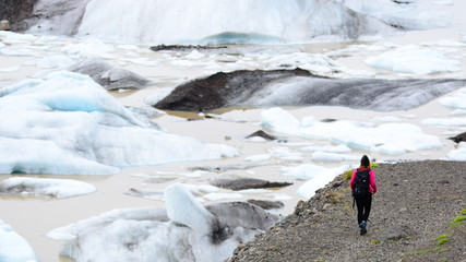 Female adventurer in a glacier - obrazy, fototapety, plakaty