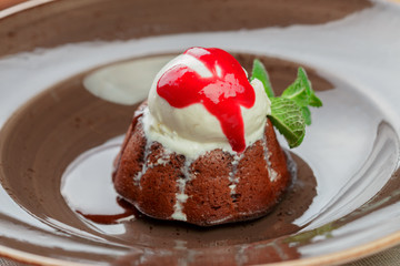 Chocolate fondant with ice cream top close up