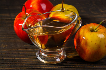 apple vinegar on a wooden rustic background