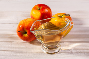 apple vinegar on a wooden rustic background
