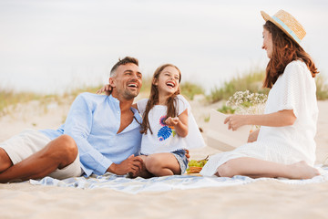 Joyful family with father, mother, daughter